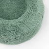 Green textured dog bed with a soft, plush surface designed for comfort and relaxation