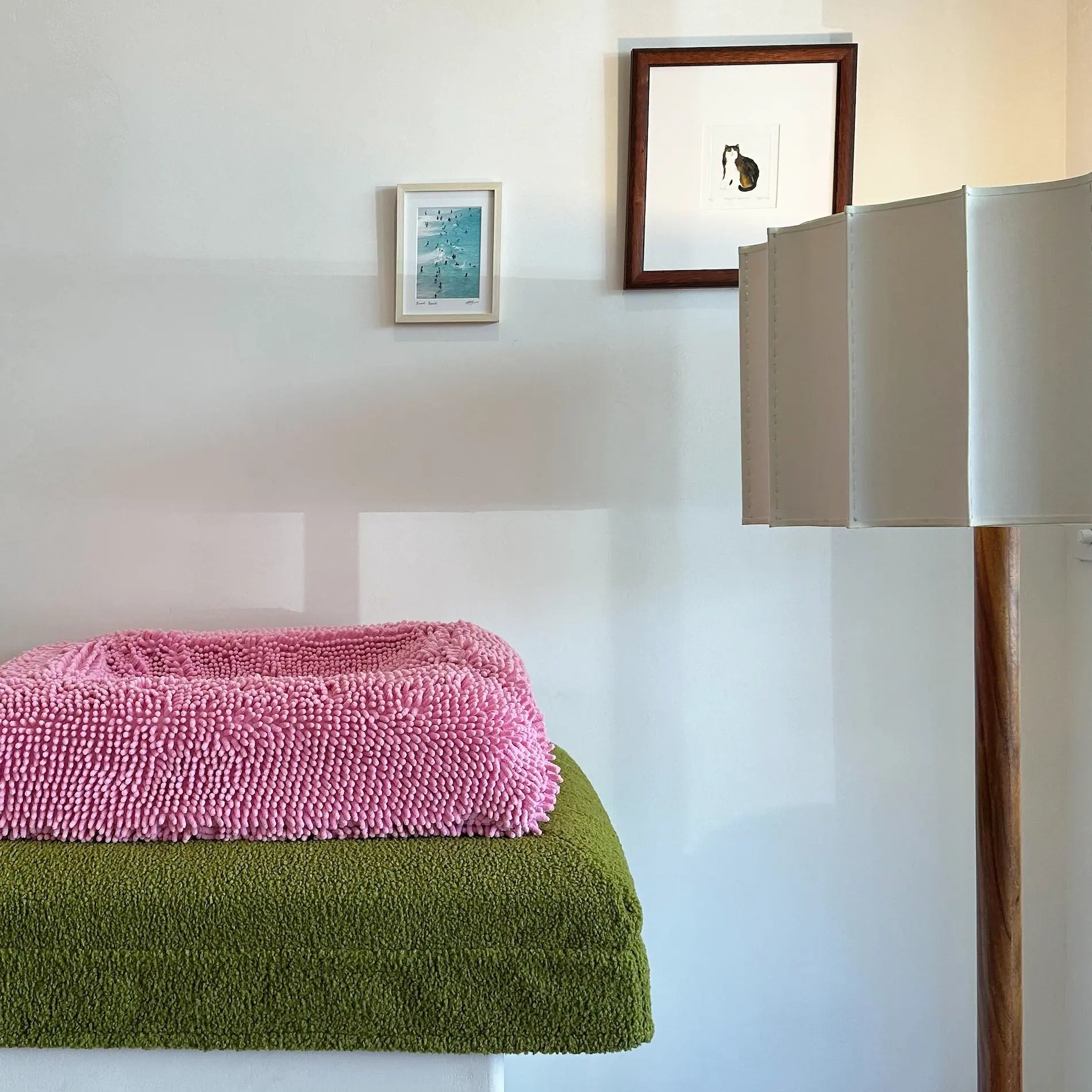 Pink and green dog bedding stacked neatly, suitable for Australian made dog beds.