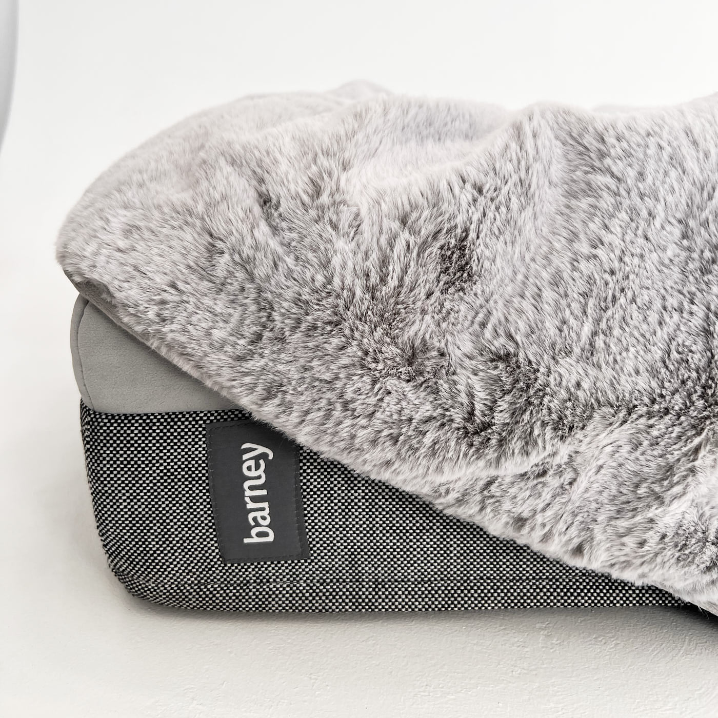 Grey luxury dog bed blanket with soft, textured fabric and a Barney label on the side
