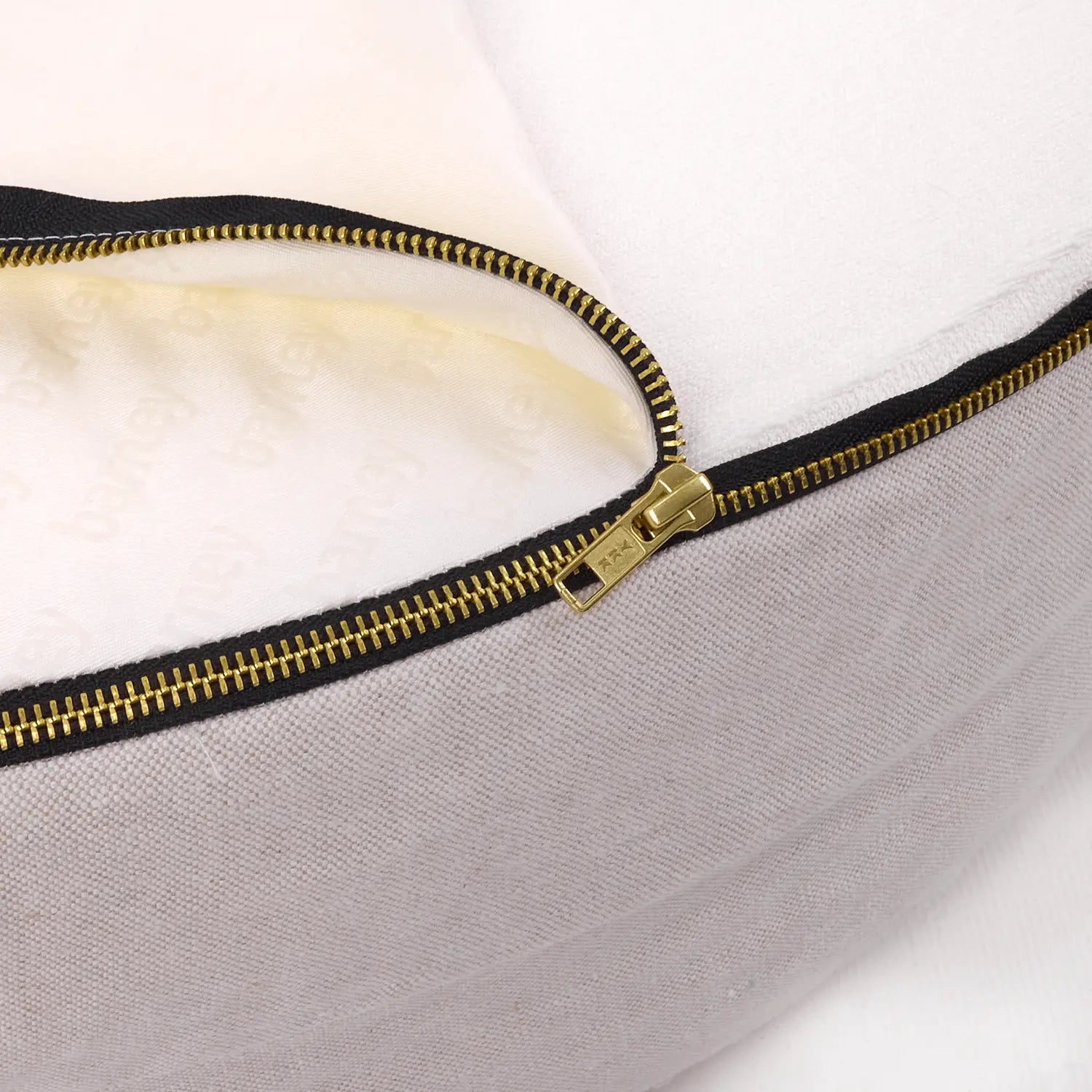 Close-up of an oat linen dog bed with a visible zip detail