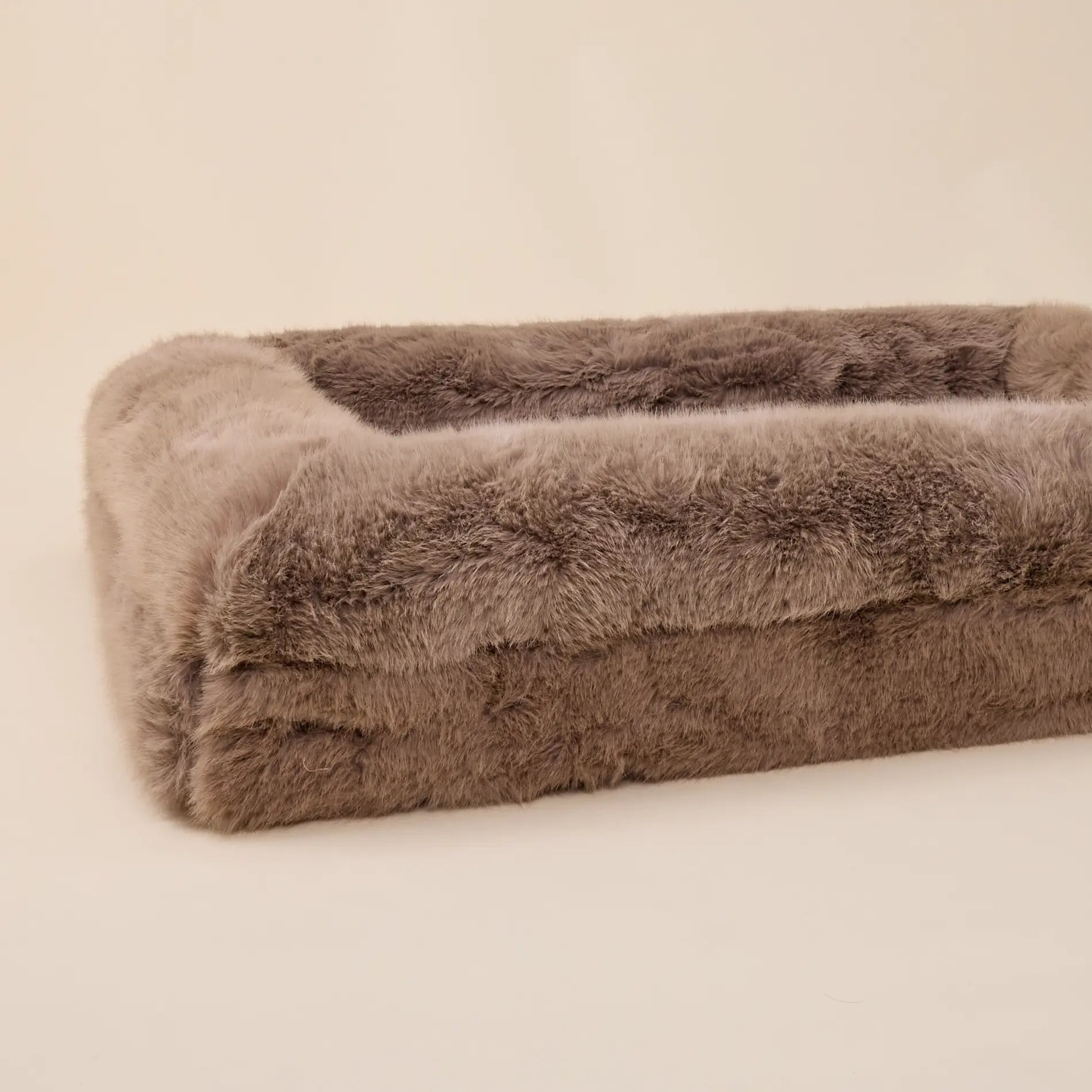 Large luxury dog bed with soft, plush fabric in a neutral tone