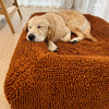Golden Retriever resting on a fur seal coloured dog bed