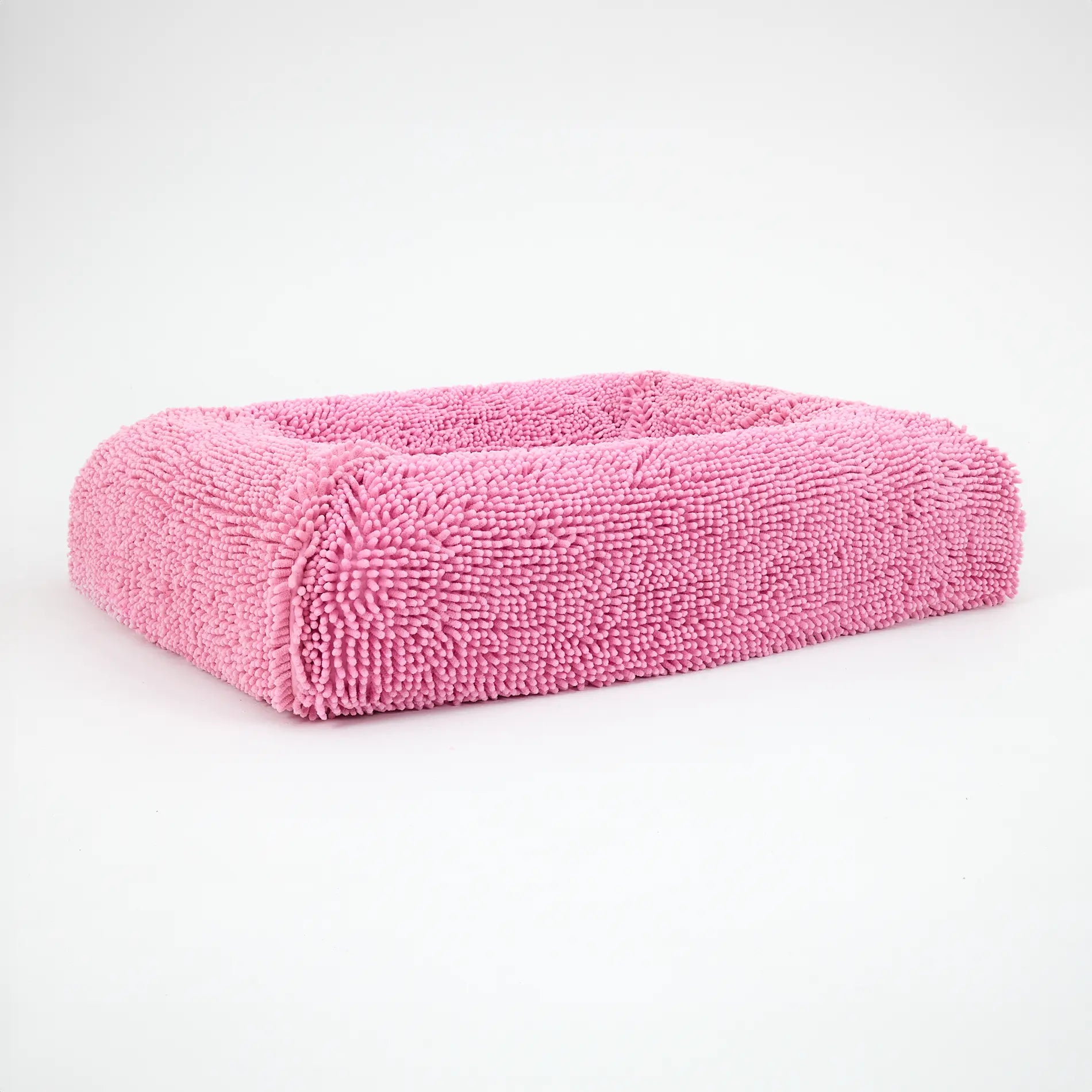 Pink luxury dog bed with a soft, textured surface designed for comfort and style